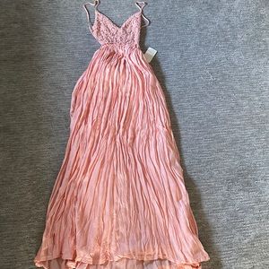 Long brand new pink backless dress. Size small, bottom portion is a bit heavy